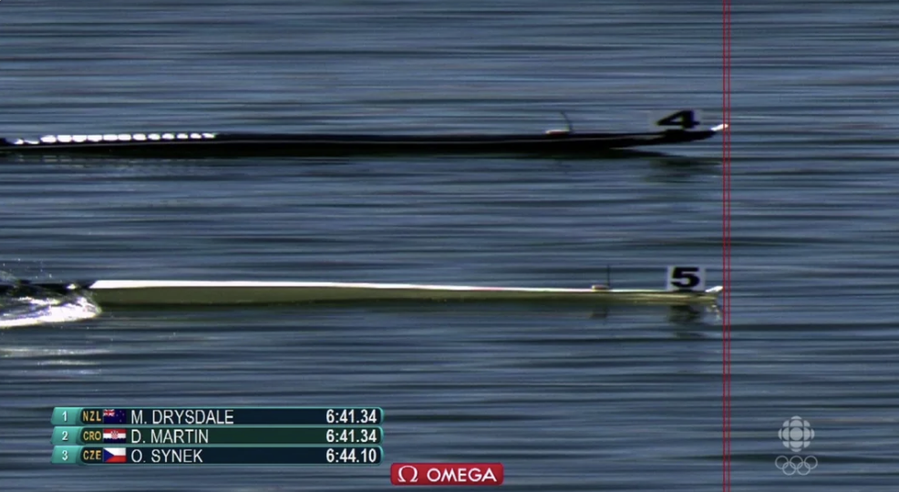 Two single sculls crossing the Olympic finish line within hundredths of a second
